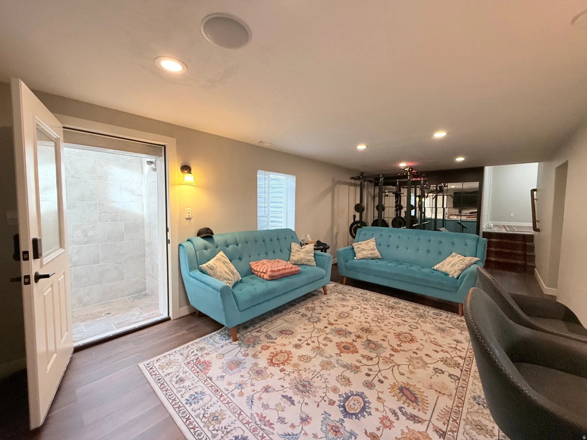 Spacious interior with dark wood-finish flooring and recessed lighting