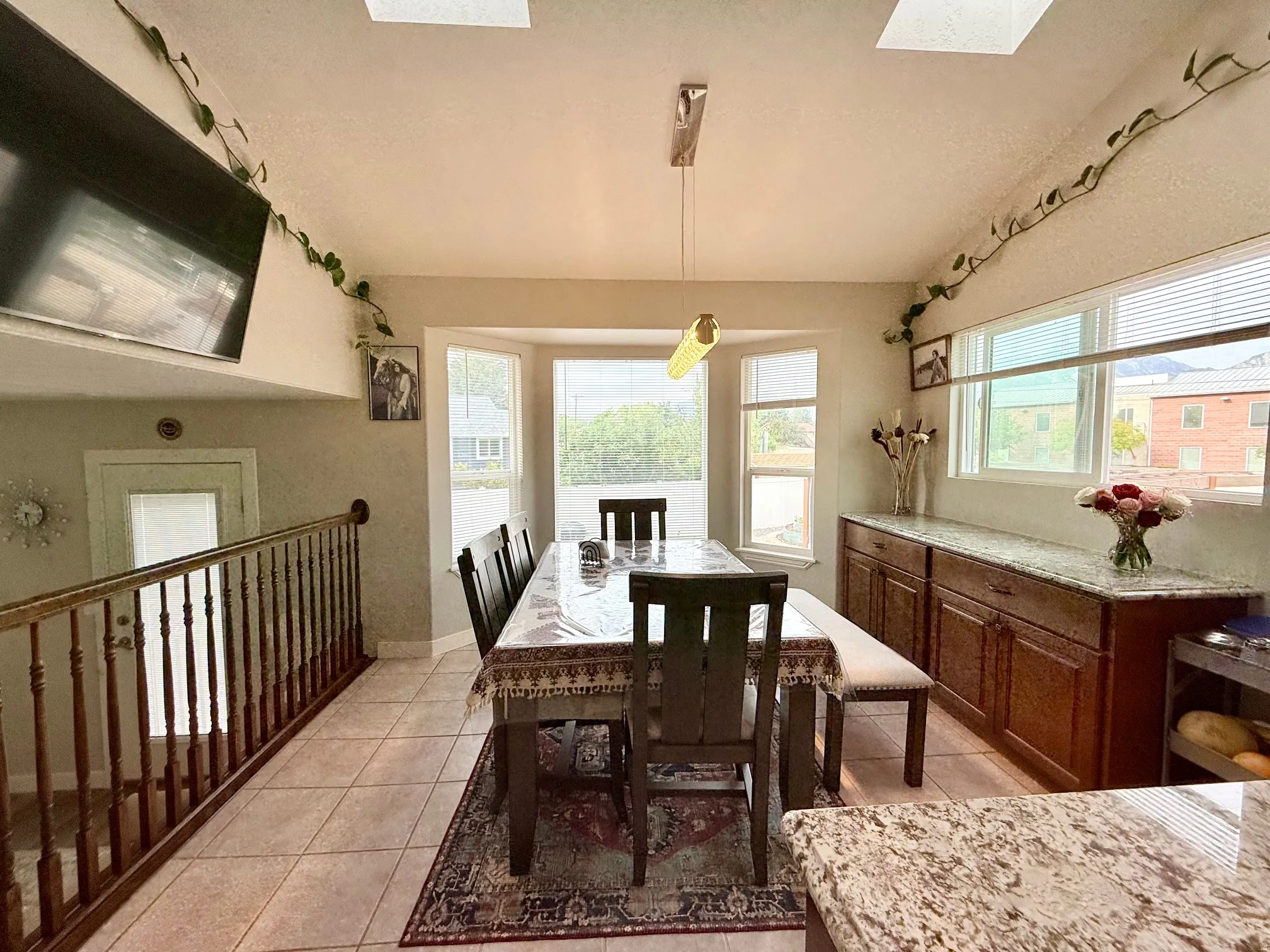Dining area featuring a bay window, recessed lighting, and skylights