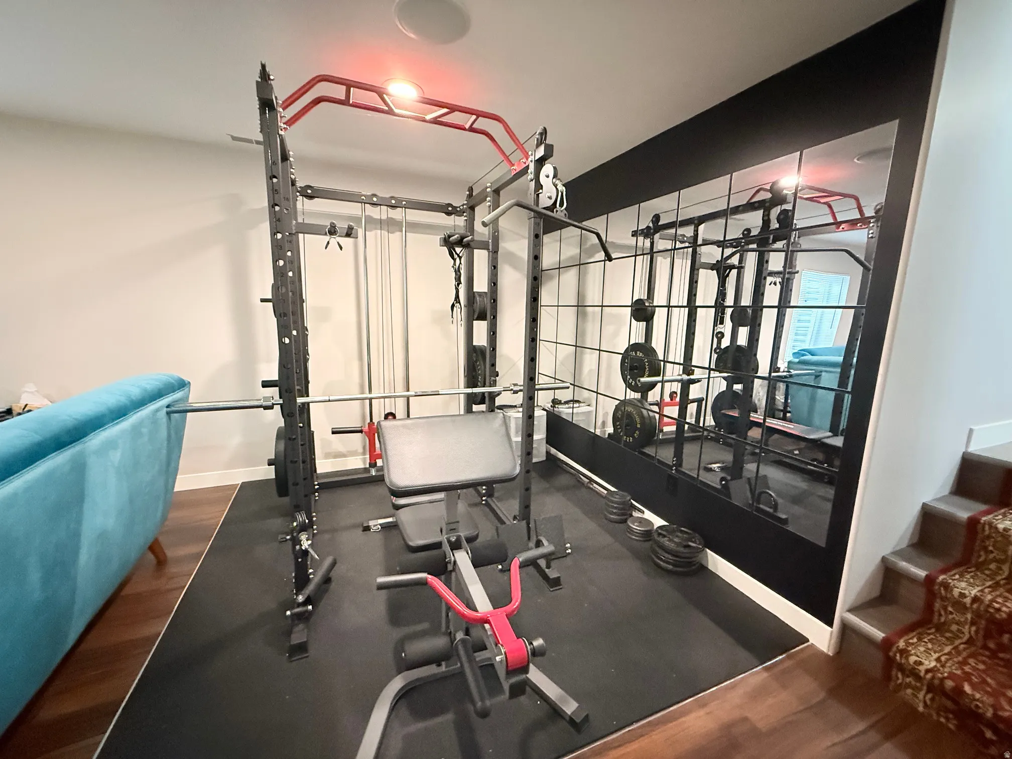 Dedicated fitness area featuring durable black rubber flooring
