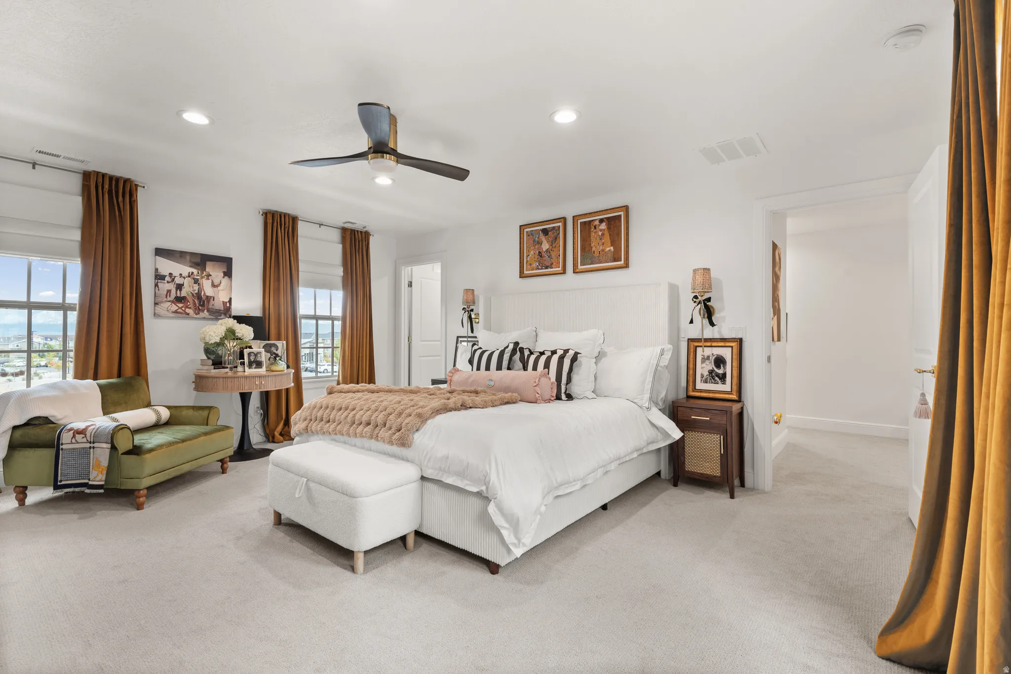 Oversized master bedroom with an abundance of natural lighting.