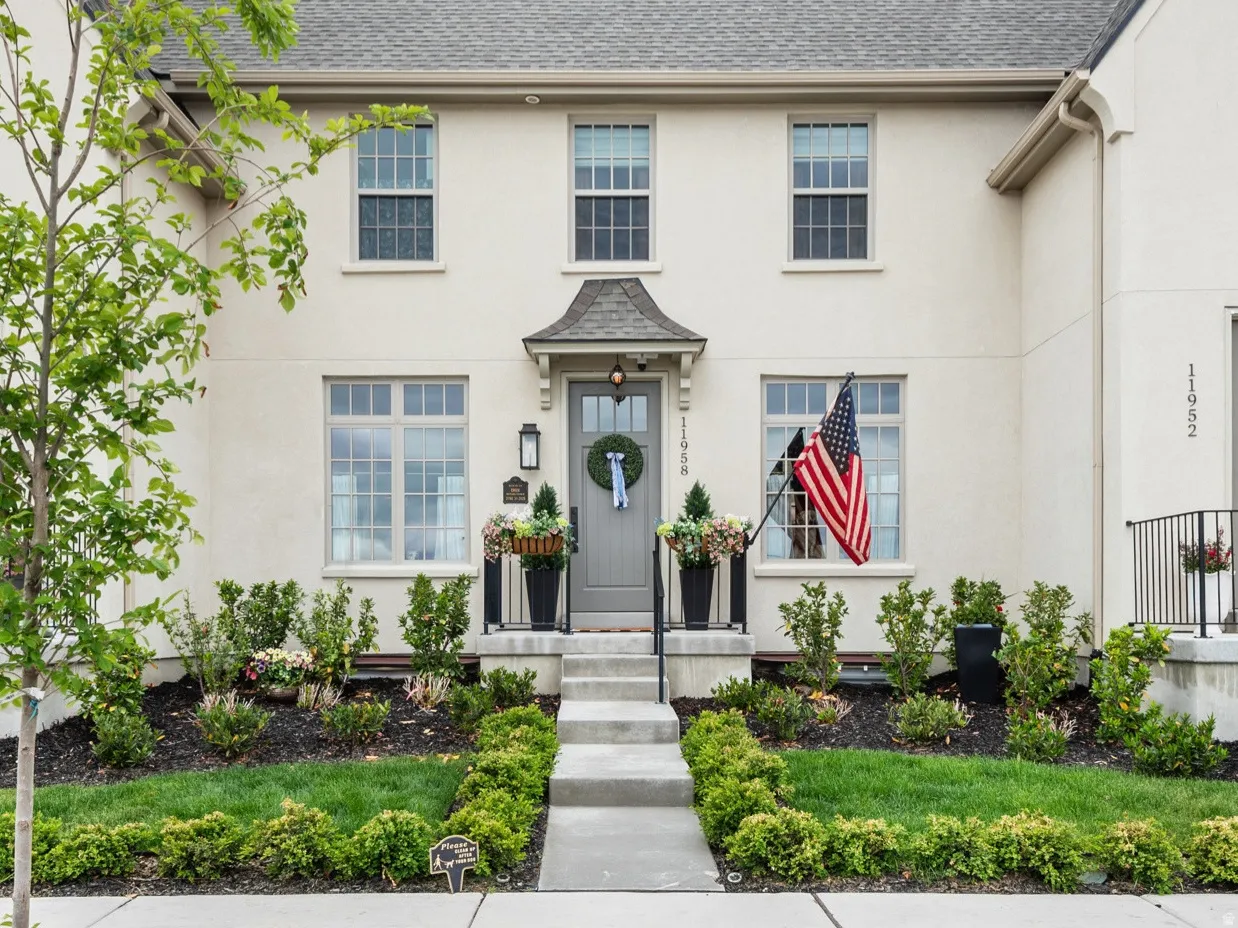Stucco exterior with gabled roofline