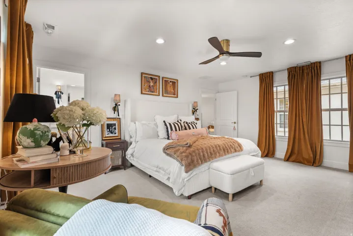 Oversized master bedroom with an abundance of natural lighting.