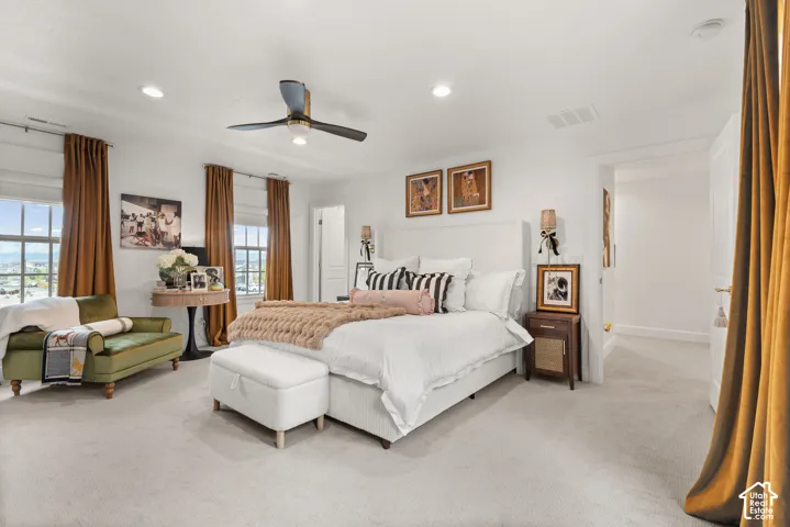 Oversized master bedroom with an abundance of natural lighting.