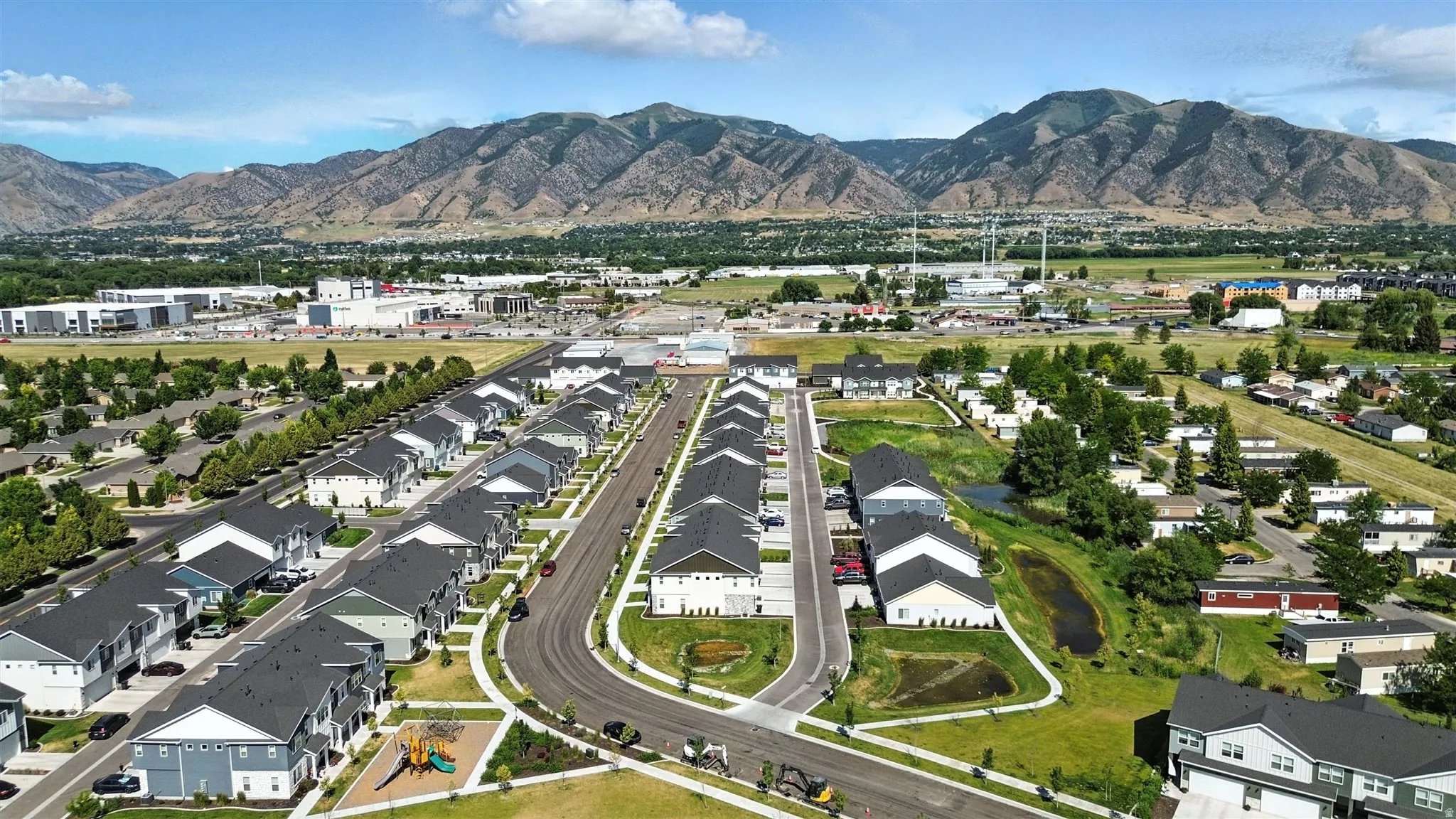 New construction residential development featuring a structured street grid and consistent architectural styles