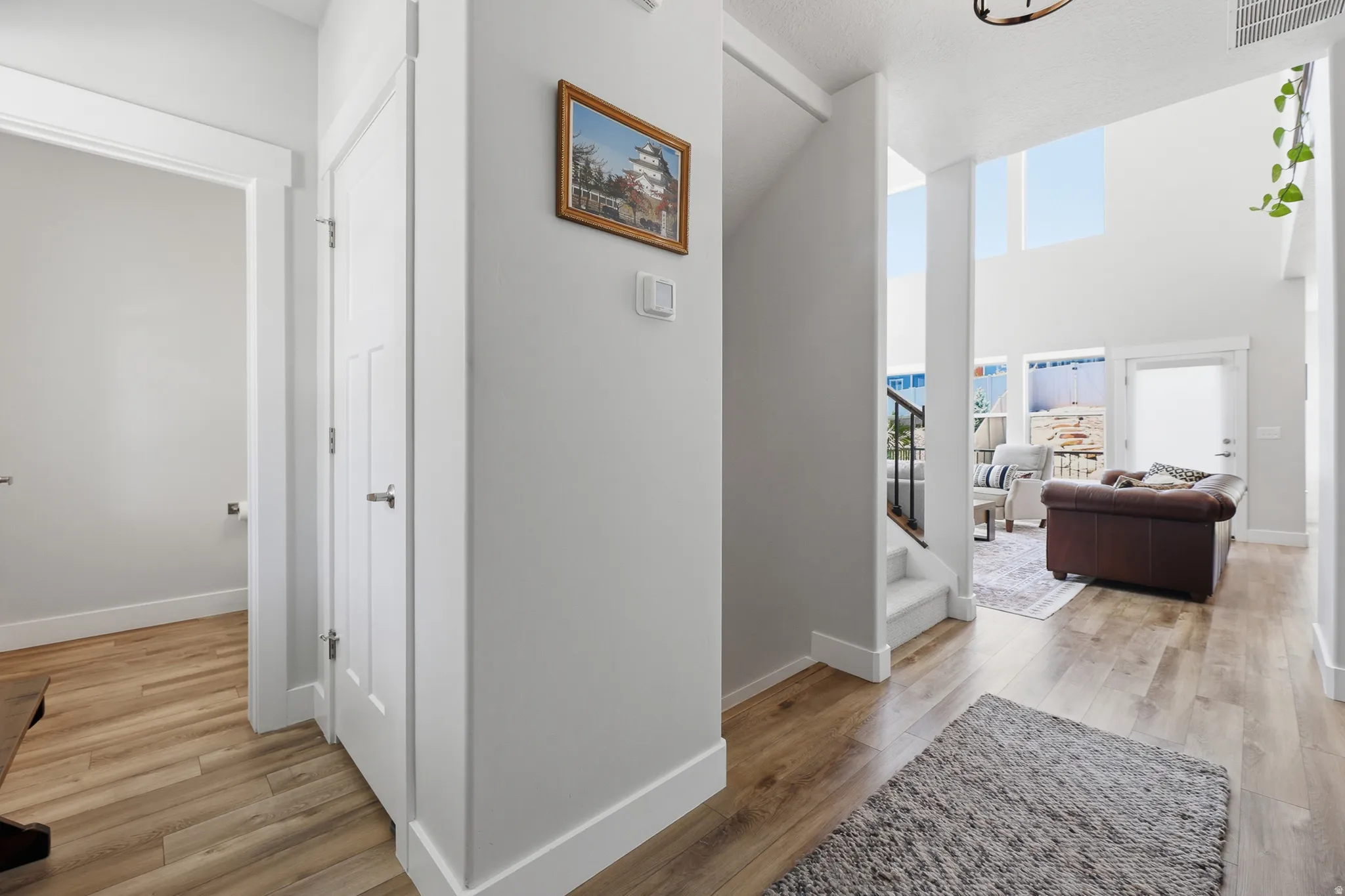 Entry of home with coat closet and half bath