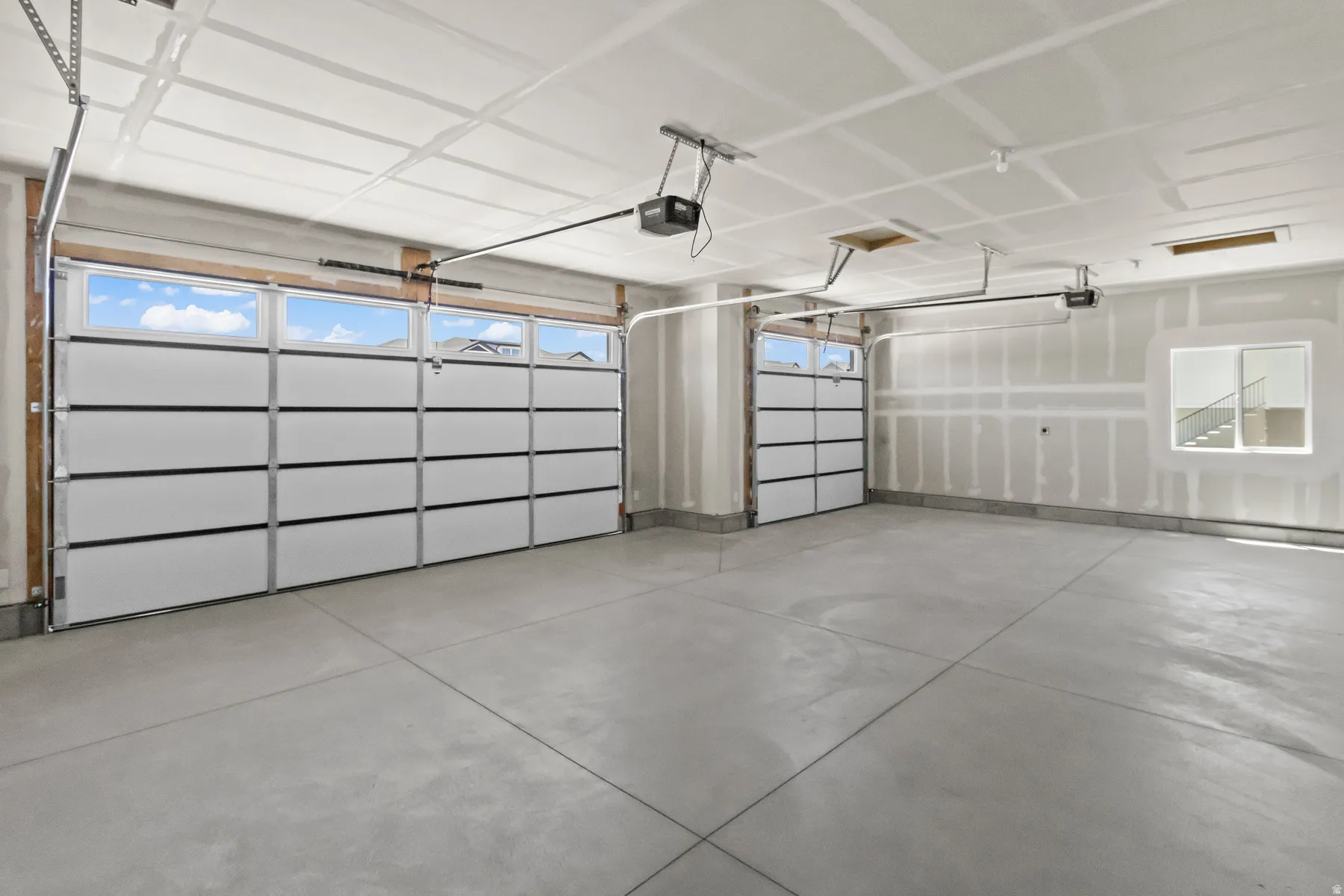 3 Car garage w/ natural lighting