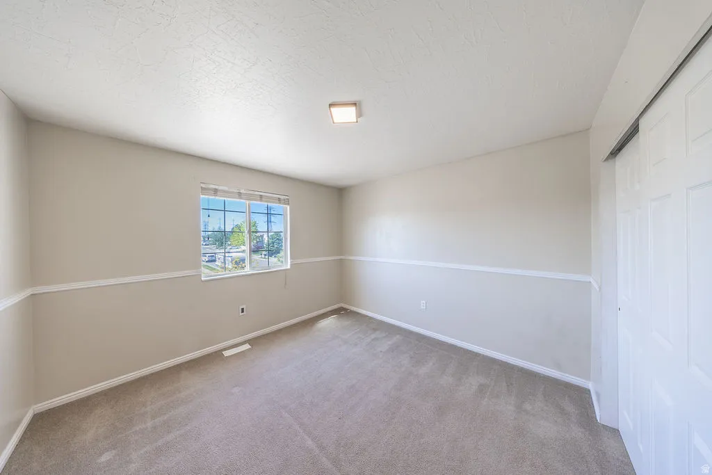 Bedroom #2 upstairs.  Neutral colors.