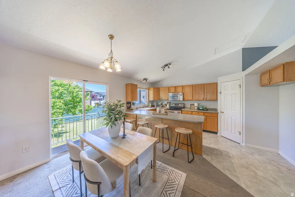Spacious dining area.  Natural light.  Convenient exit to back yard.