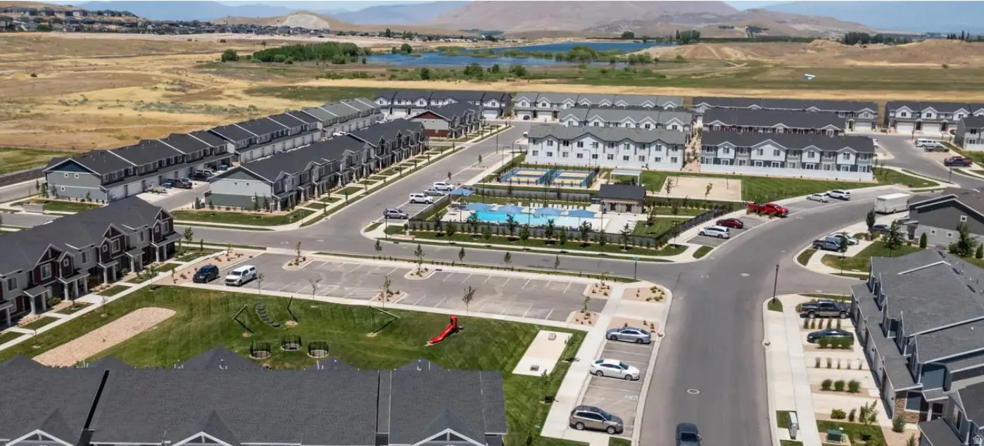 Community featuring a central swimming pool, open-air cabana, and multiple recreational courts