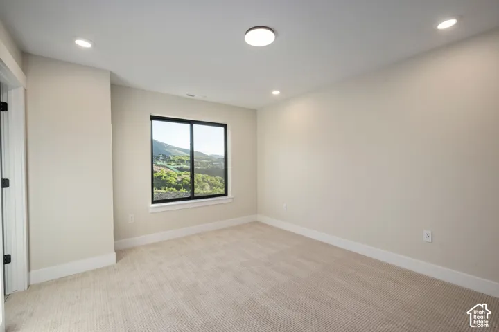 Neutral-toned carpeting paired with light walls