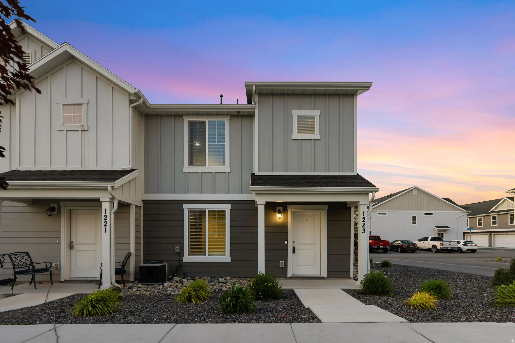 Modern facade featuring vertical and horizontal siding in a multi-tone color scheme