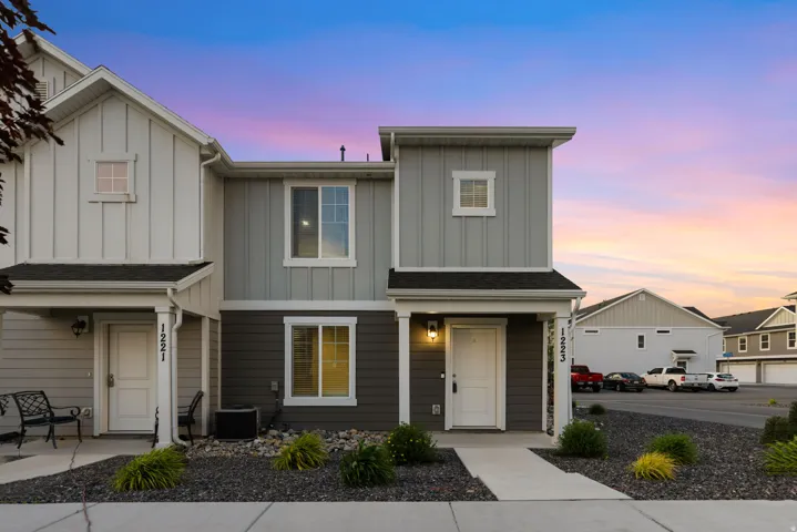 Modern facade featuring vertical and horizontal siding in a multi-tone color scheme