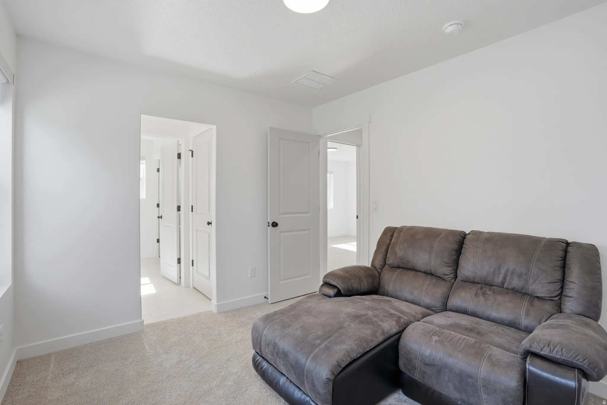 Neutral-toned carpeting throughout