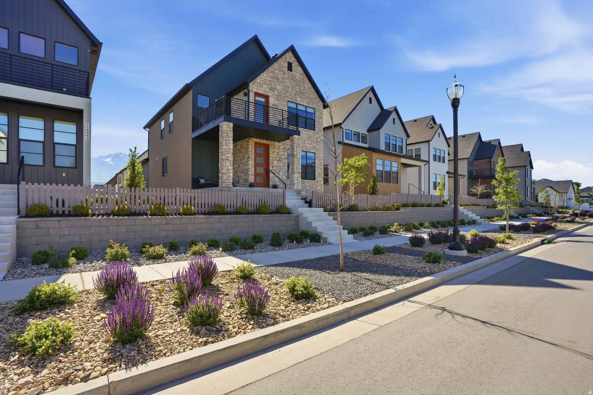 Modern architectural design featuring stone and siding exterior