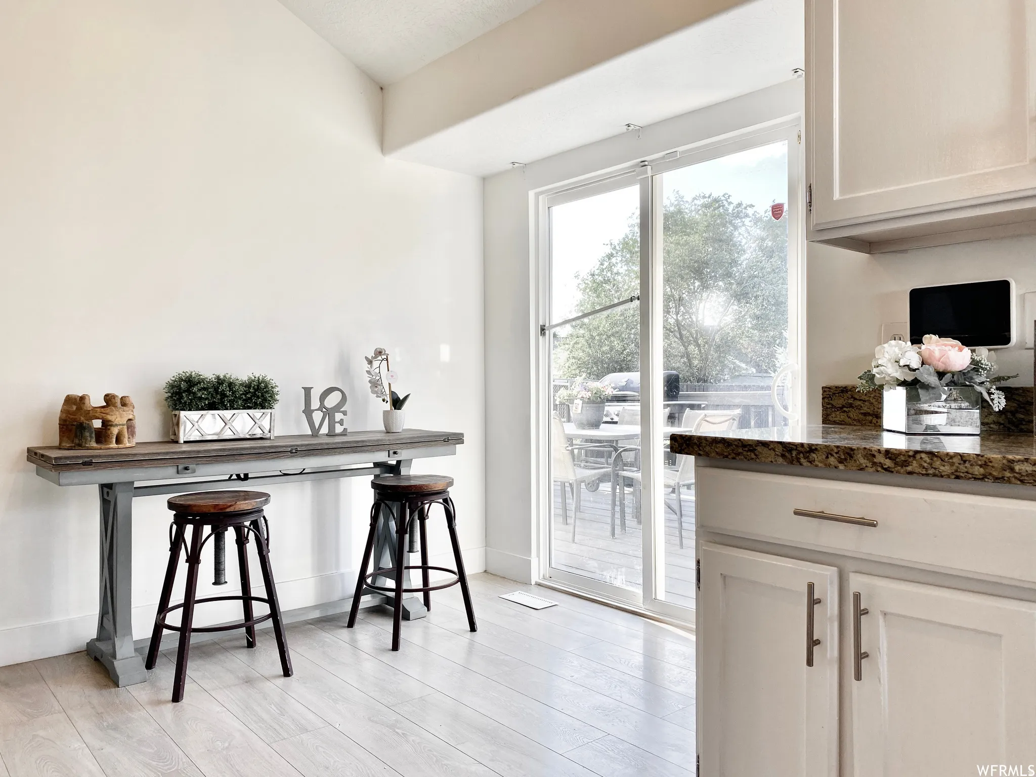 Sliding glass doors opening to an outdoor deck