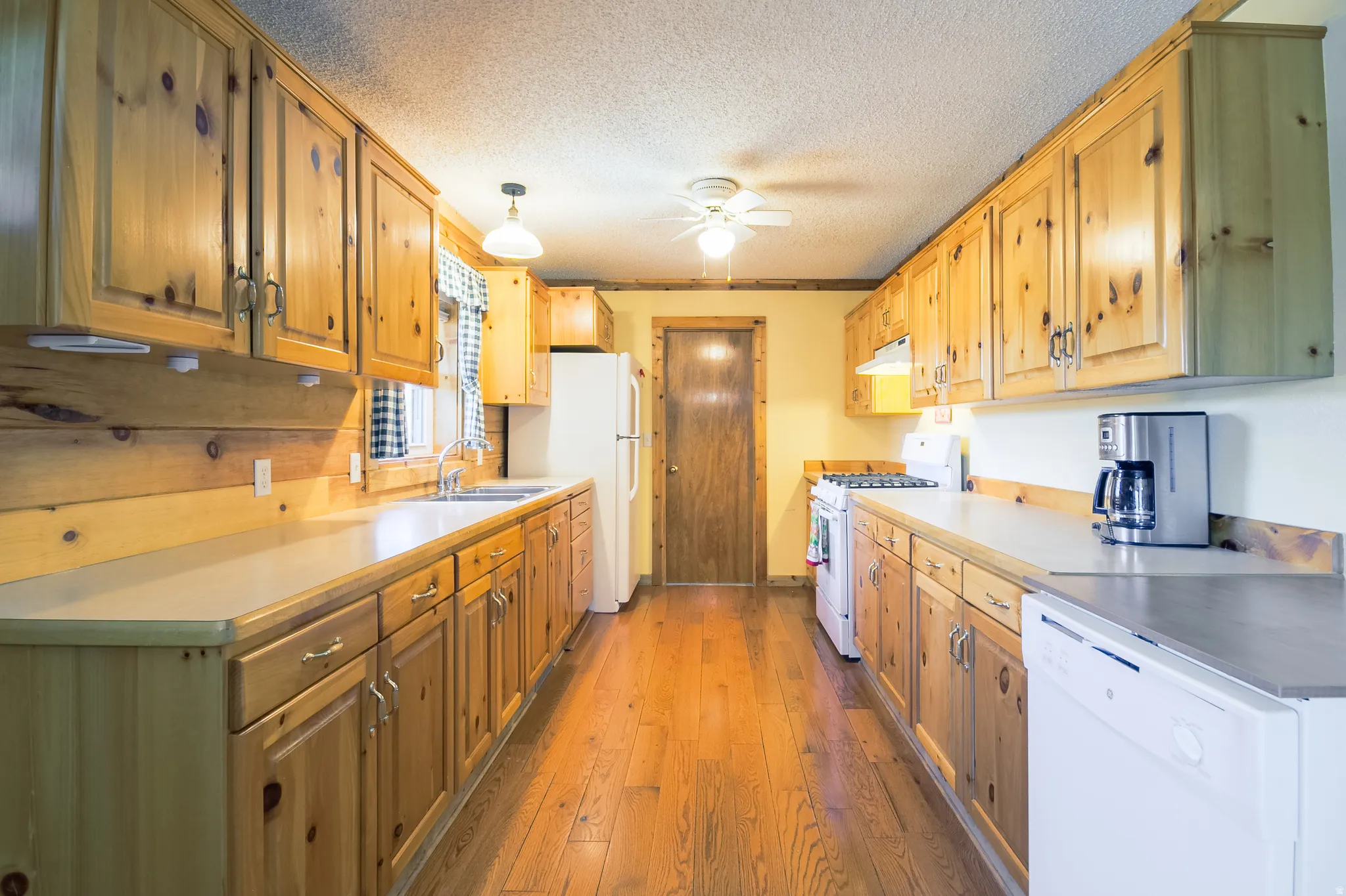 Kitchen looking toward laundry room door.