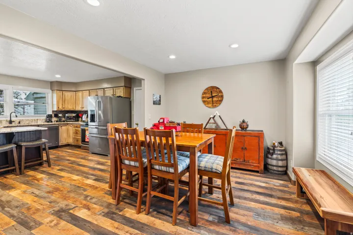 Open-concept living space featuring wood-finish flooring