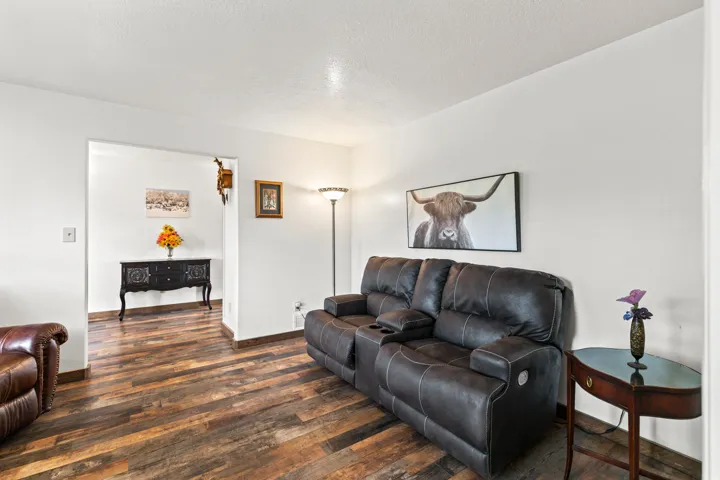 Expansive interior with wood-finish flooring and a bright white color palette