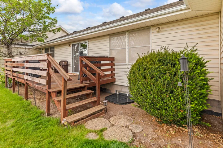 Outdoor wooden deck with steps and railings