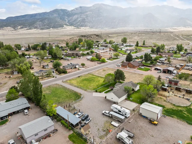 Aerial perspective showcasing a residential area set against a mountainous backdrop