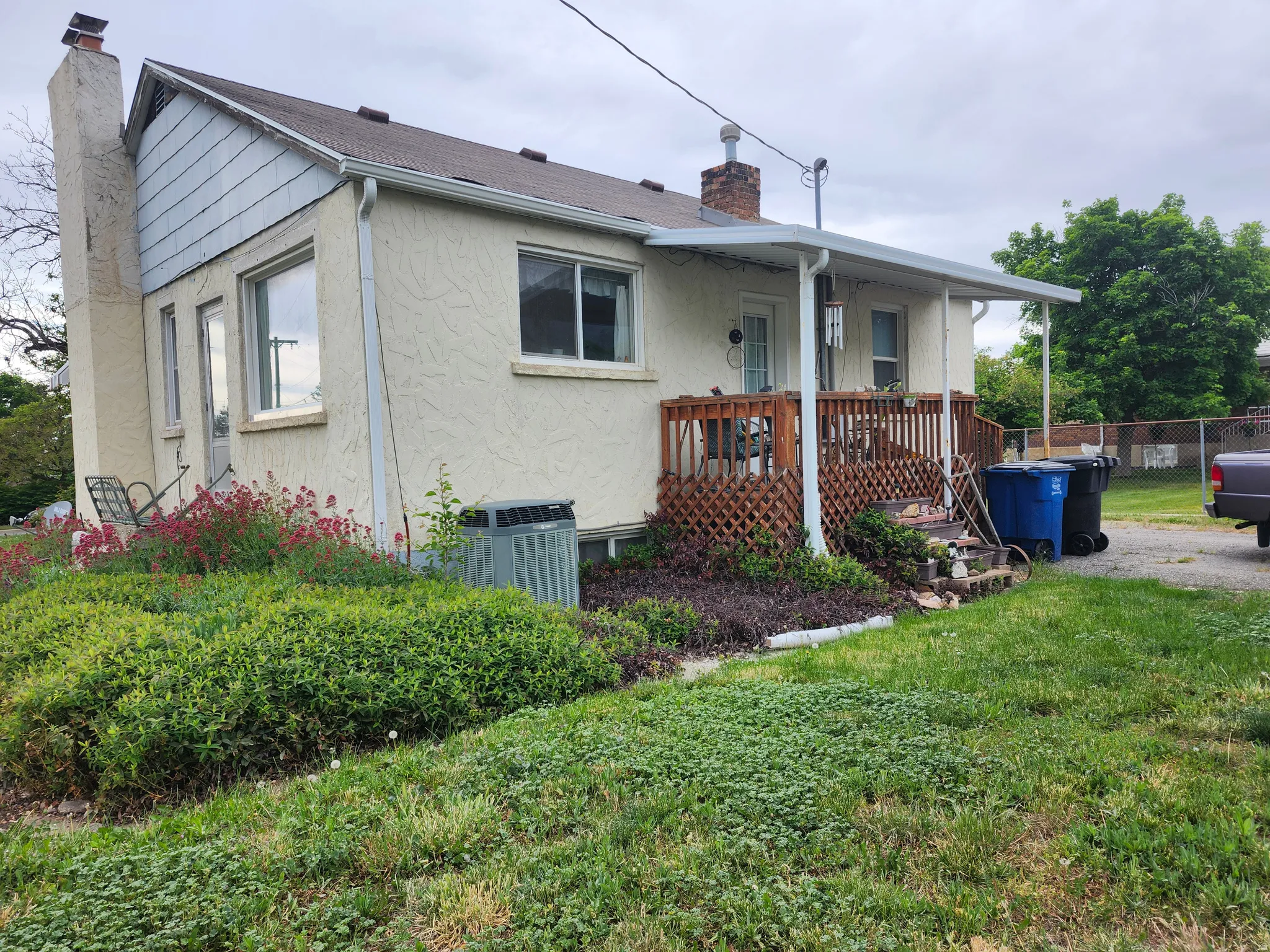 Back porch with plant beds