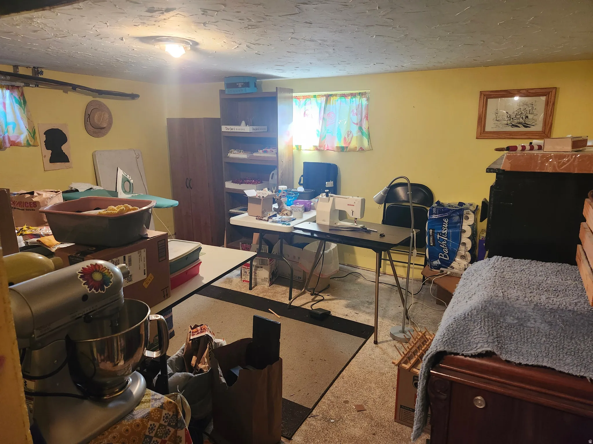 Basement area featuring painted yellow walls and two small windows