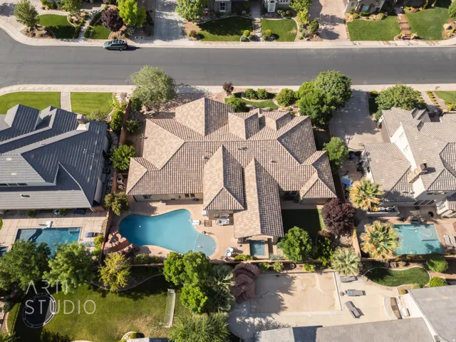 Expansive property featuring a large main residence with a multi-gabled tile roof and a private backyard oasis