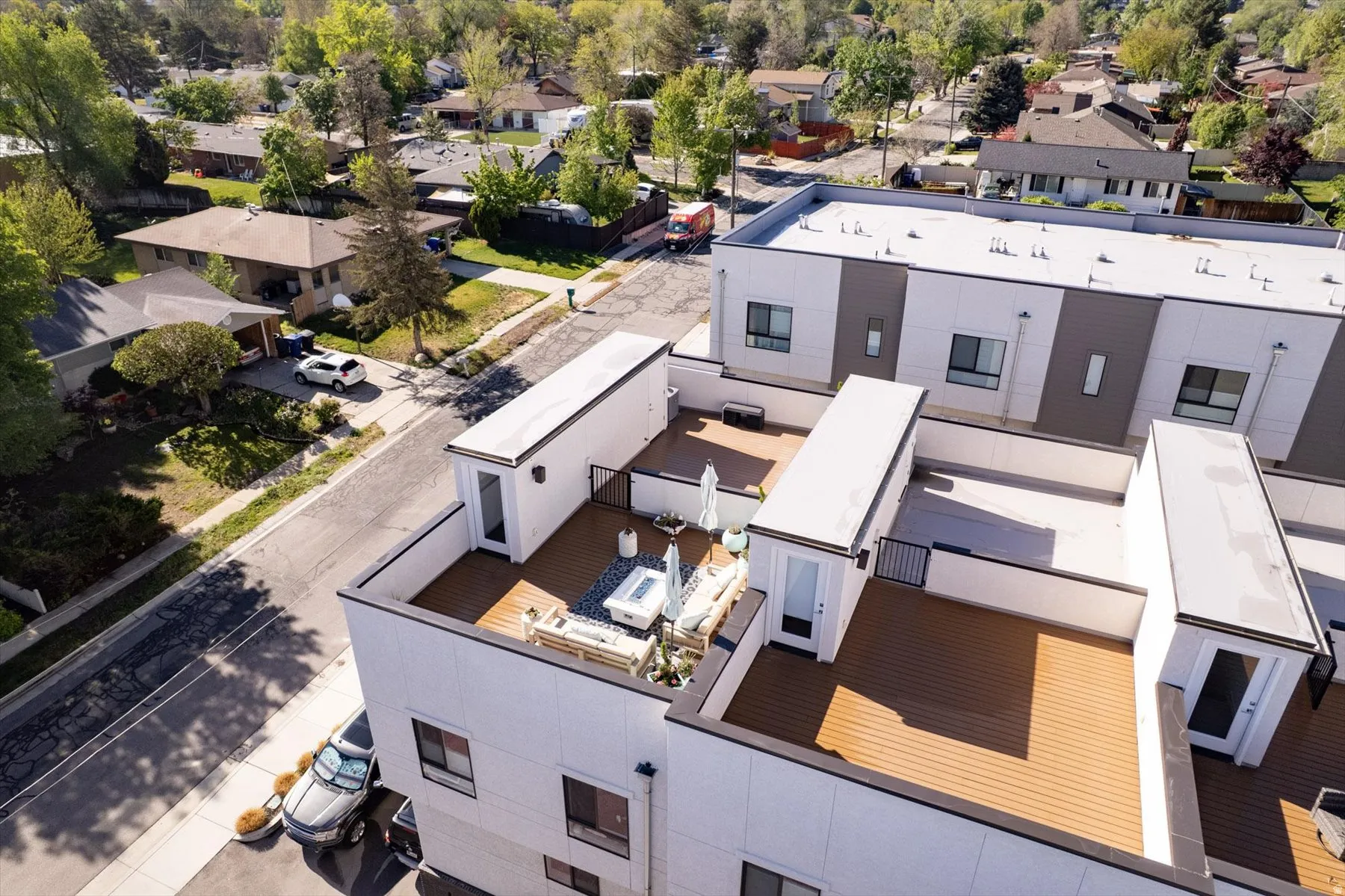 Rooftop terrace with wood-finish decking and perimeter railing