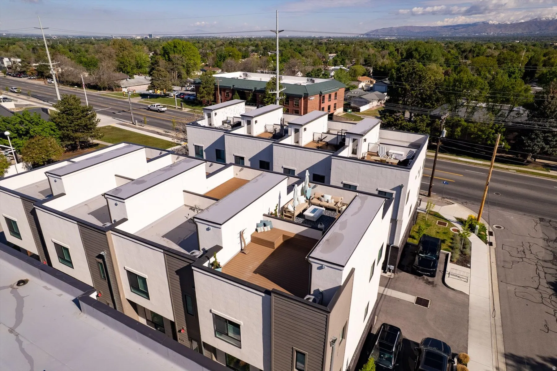 Modern townhome exteriors featuring flat roofs and private rooftop decks
