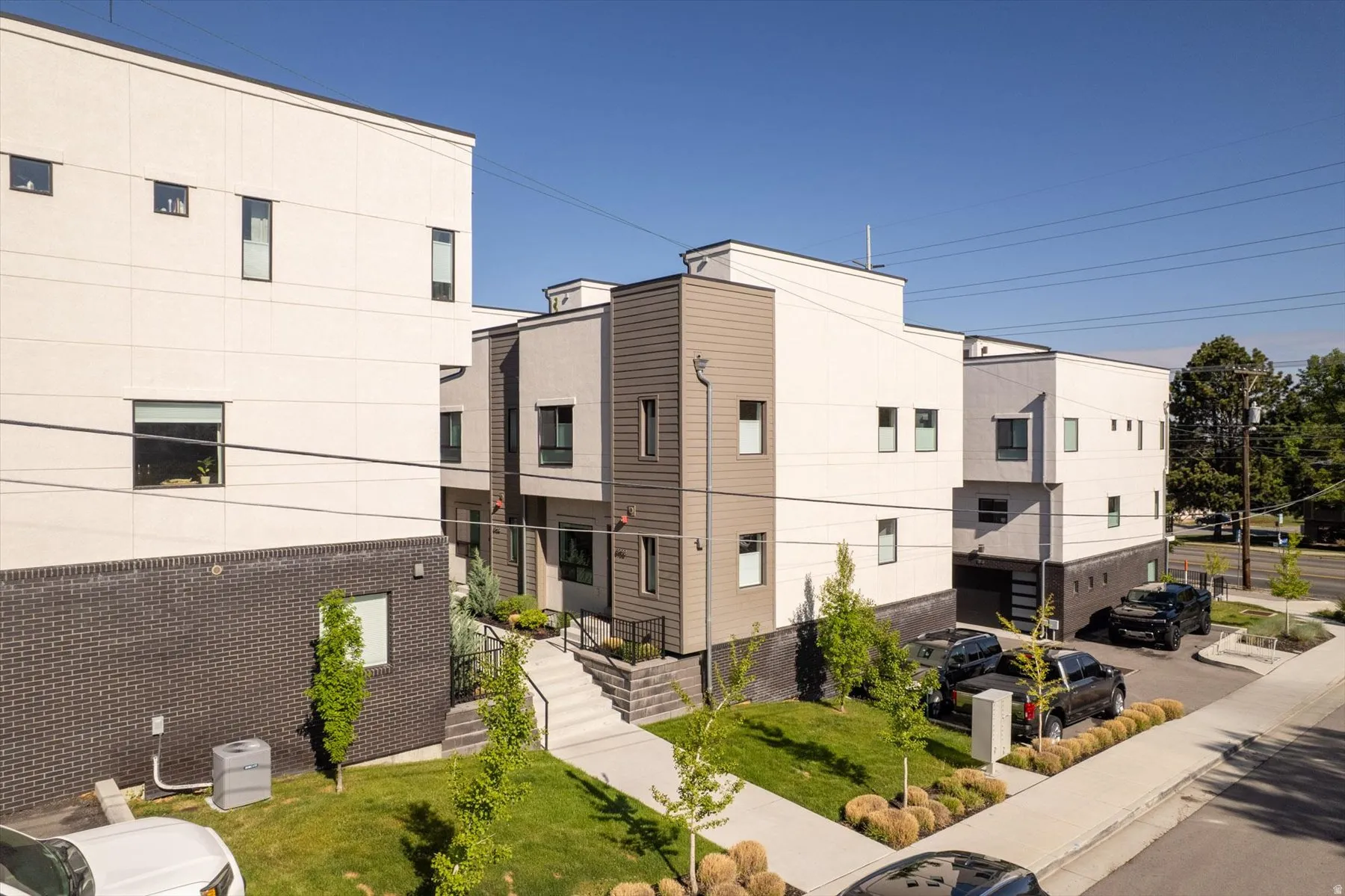 Modern townhome complex featuring clean lines and a contemporary facade