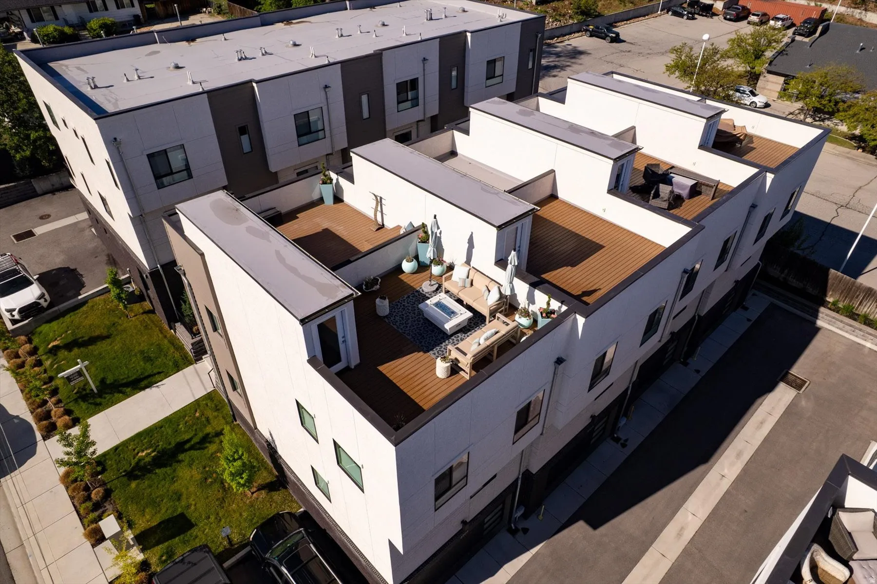 Modern townhome featuring a rooftop deck with wood-finish flooring