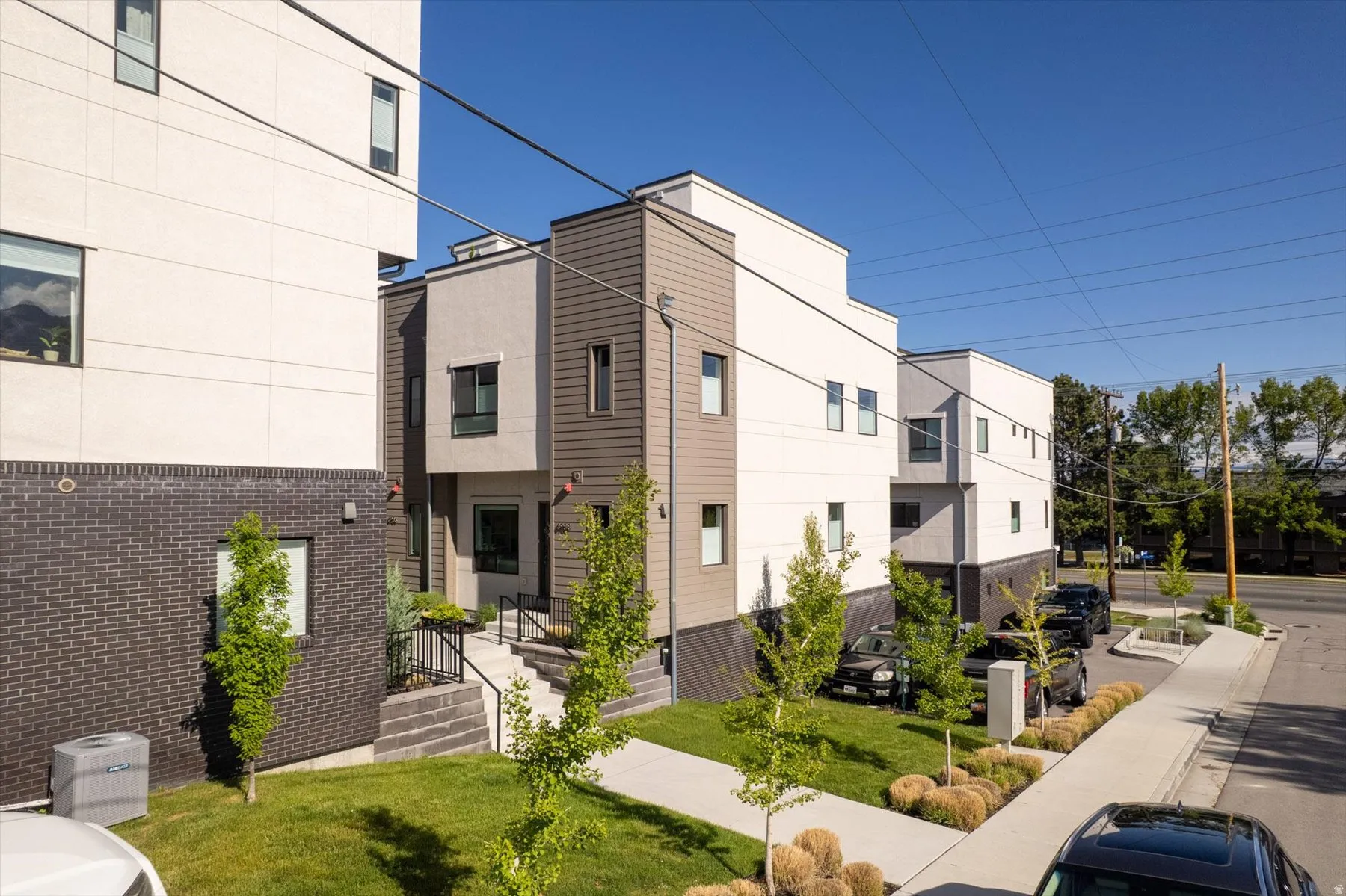 Modern multi-story facade featuring clean lines and a contemporary aesthetic