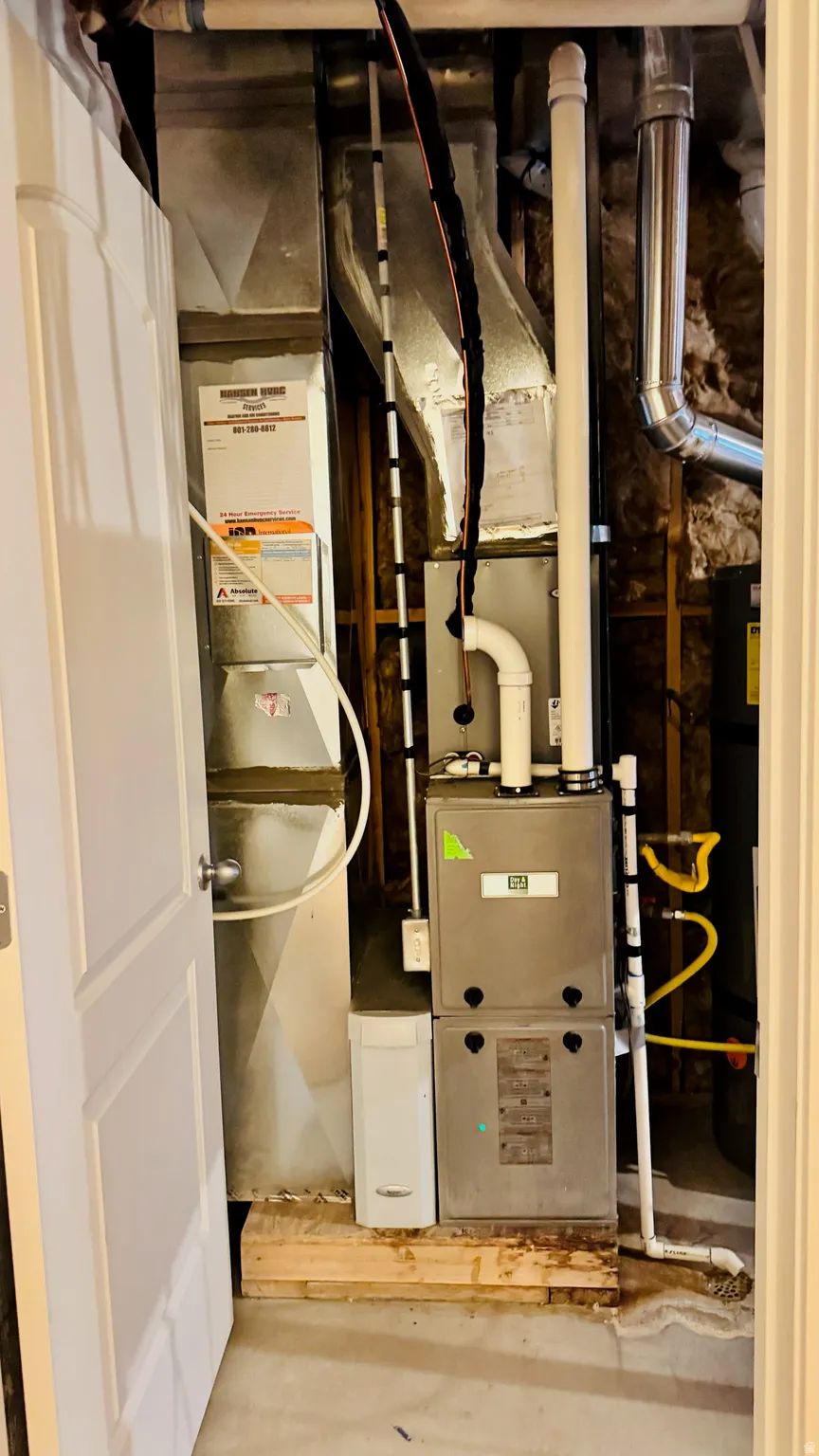 Heating, ventilation, and air conditioning (HVAC) system with associated ductwork and piping within a utility closet