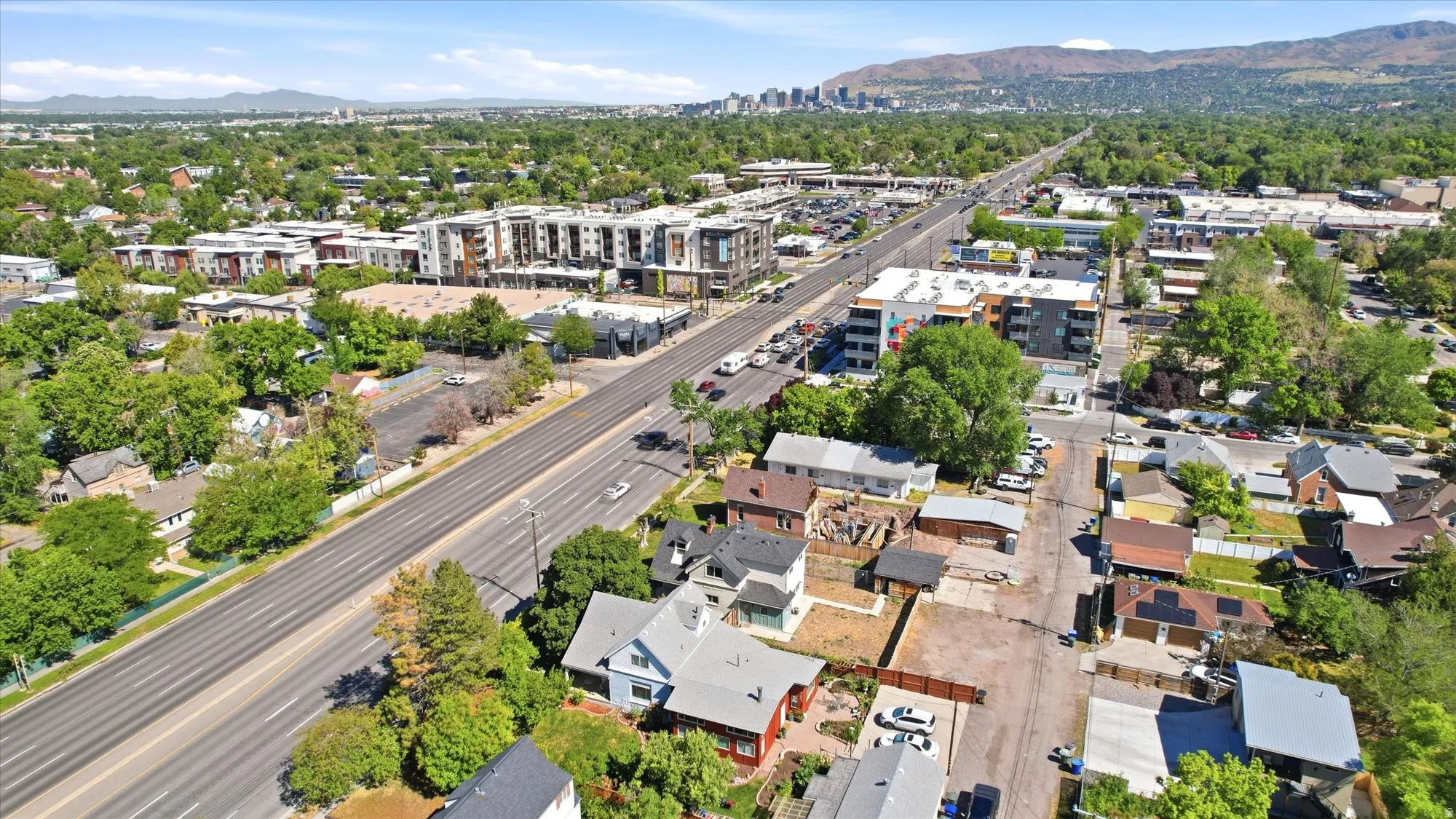 Aerial perspective showcasing urban surroundings with a prominent thoroughfare