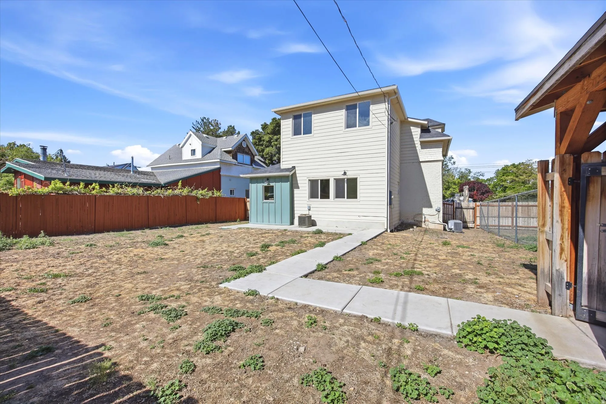 Two-story exterior with horizontal siding and multiple windows