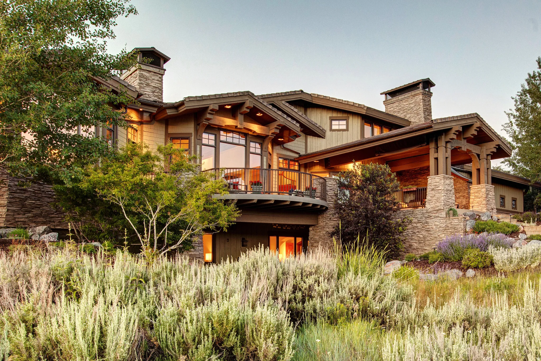Craftsman-style exterior featuring stone and wood siding