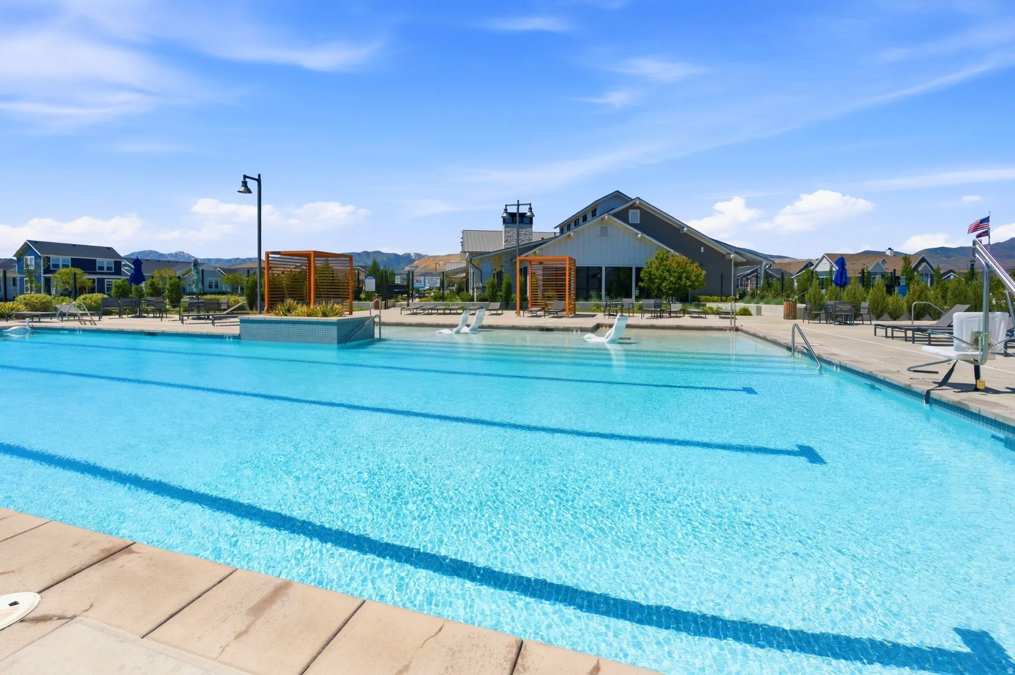 Expansive outdoor swimming pool with a surrounding stone deck