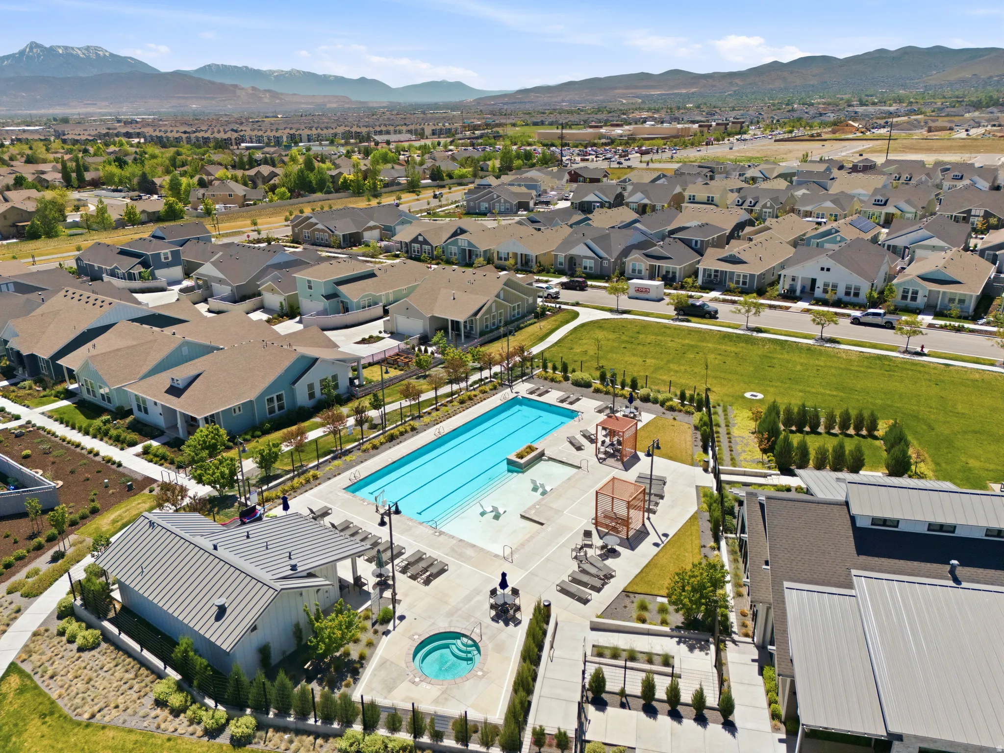 Community swimming pool with dedicated lap lanes and an integrated spa