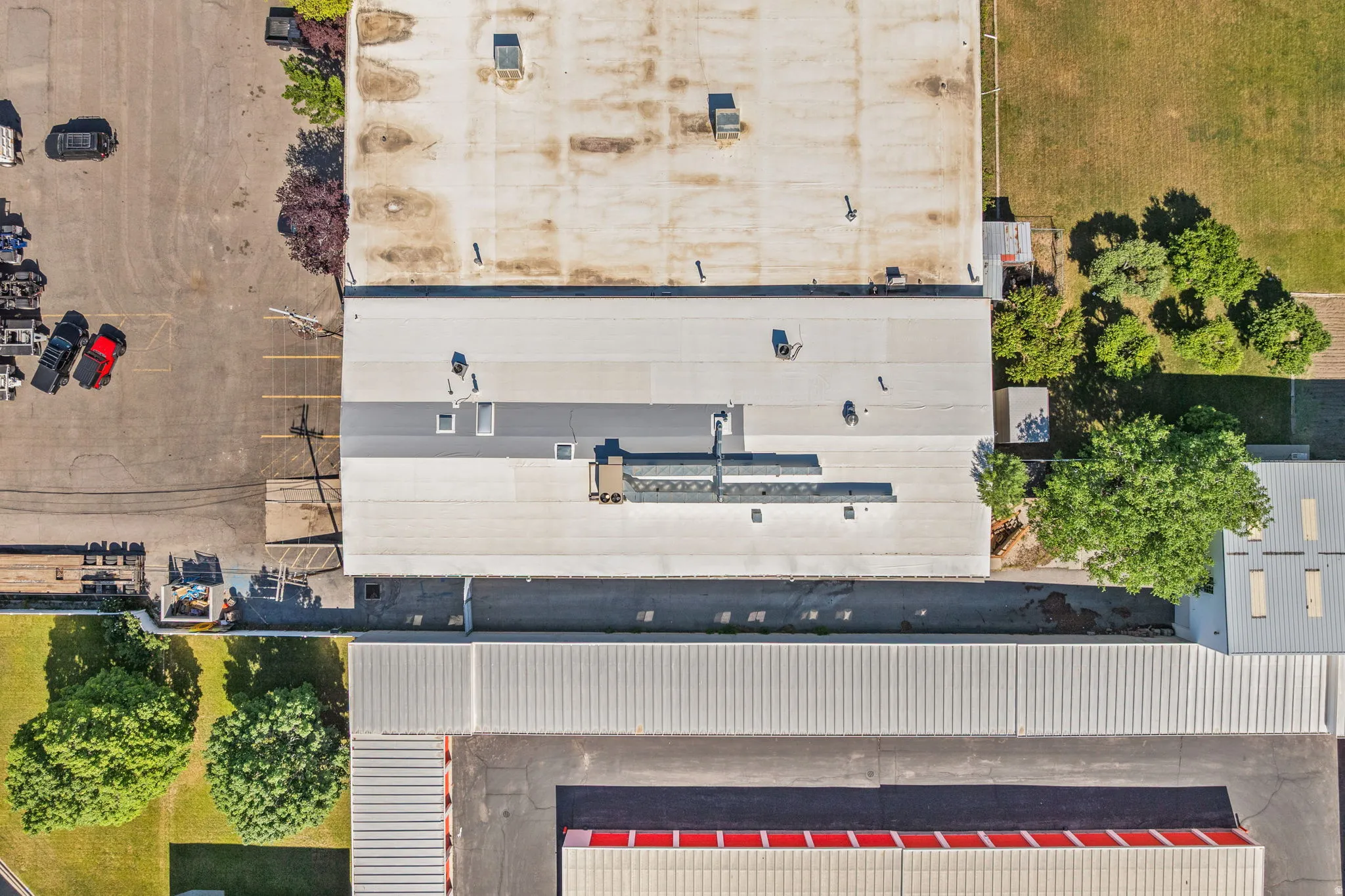 Aerial perspective showcasing multiple industrial buildings with various roof types