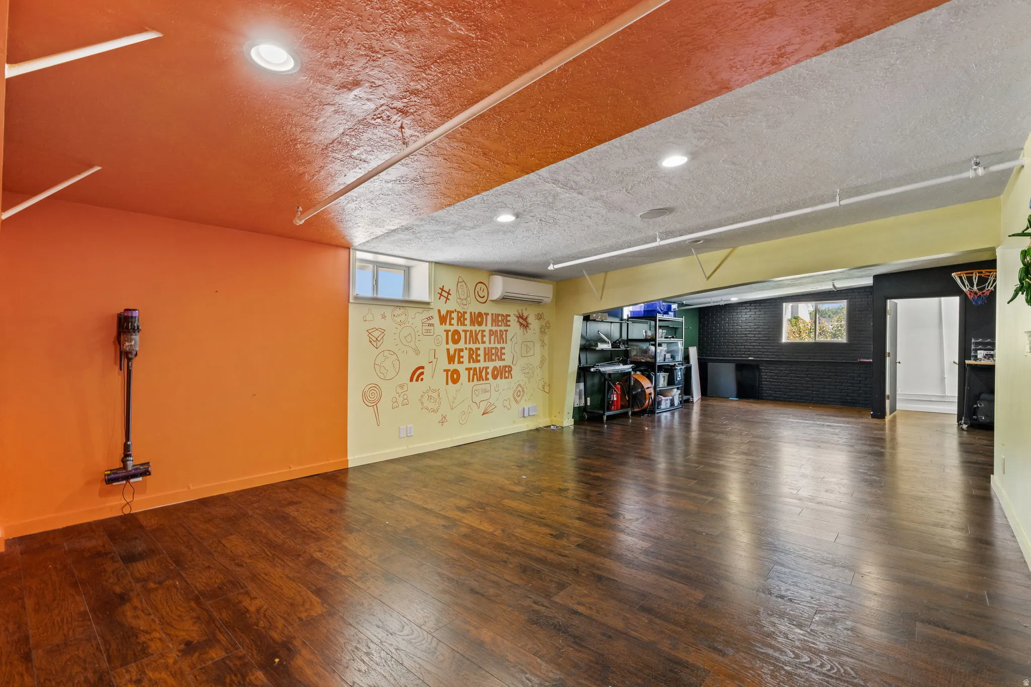 Spacious lower level featuring wood-finish flooring, recessed lighting, and a window