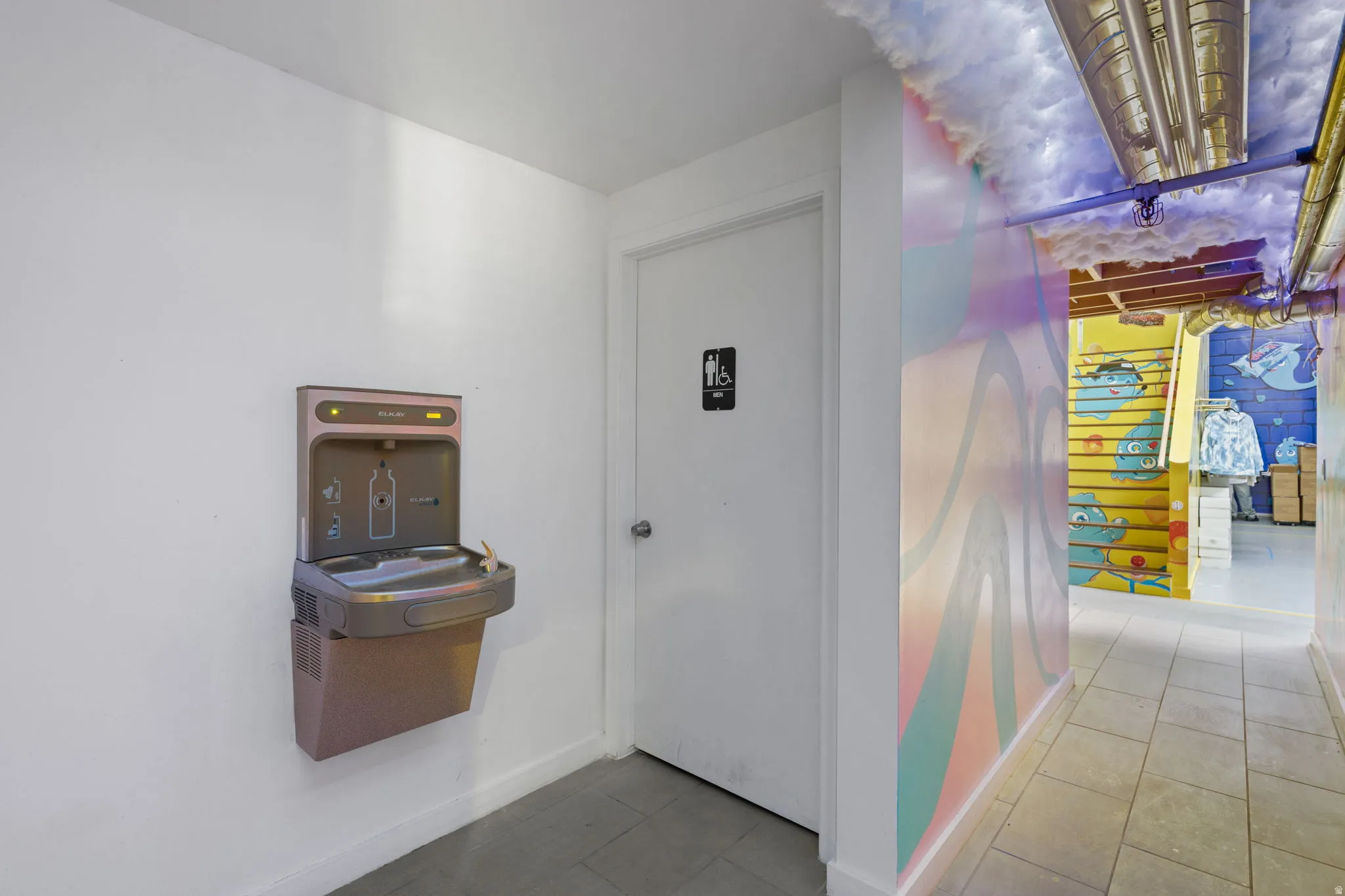 Wall-mounted water fountain with bottle filler