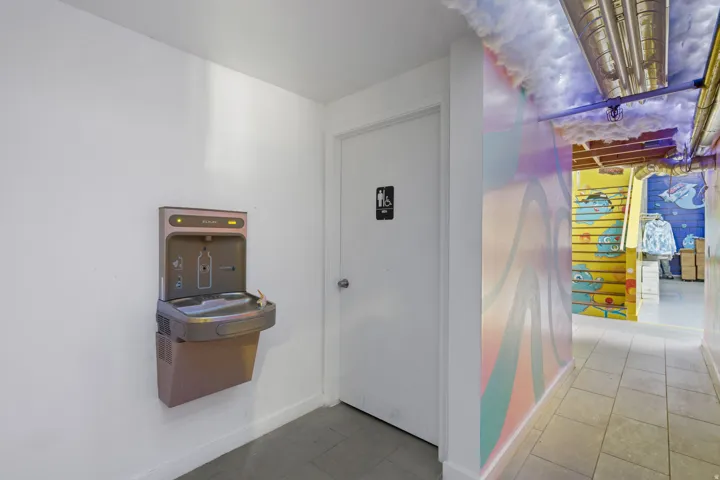 Wall-mounted water fountain with bottle filler