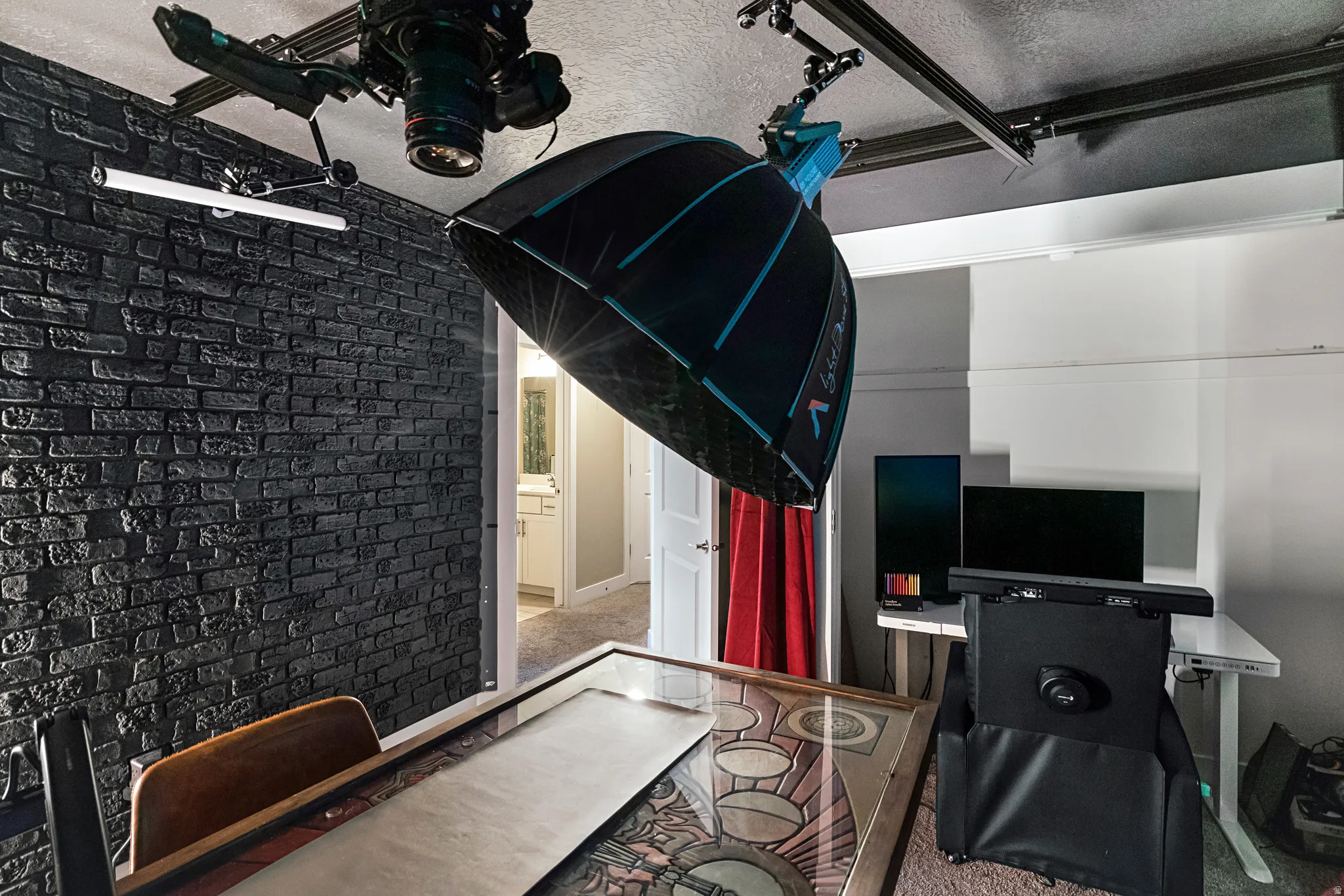 Exposed brick wall with a matte black finish