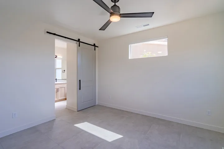 Neutral-toned tile flooring throughout
