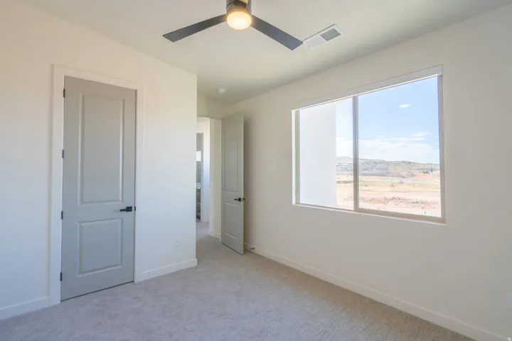 Neutral wall paint with light-colored carpeting