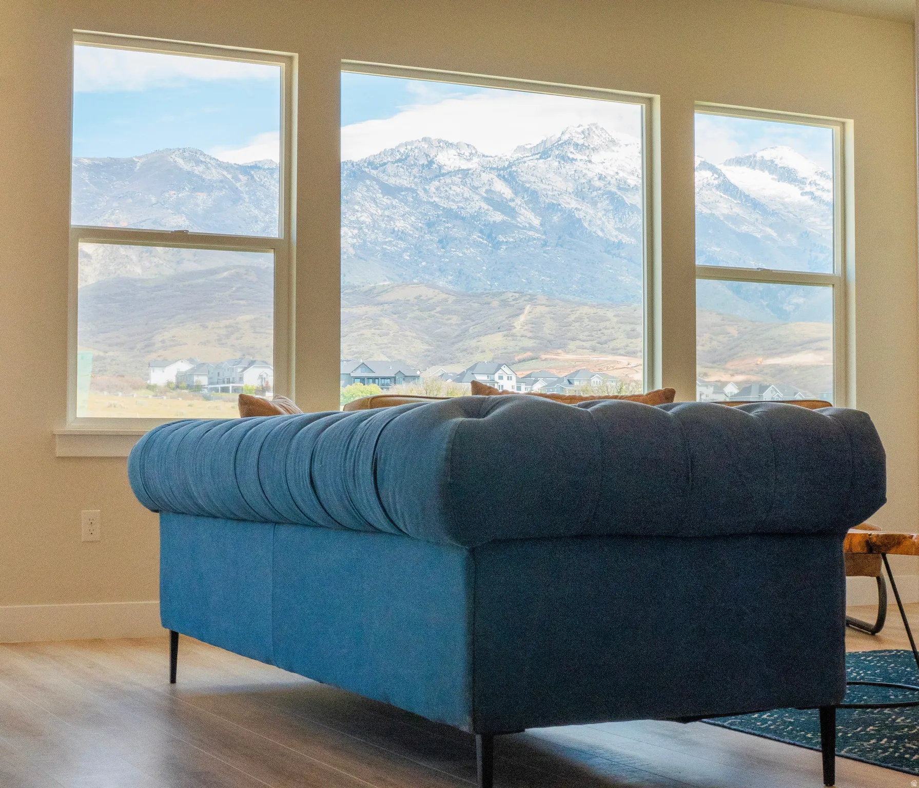 Large windows framing a mountain backdrop