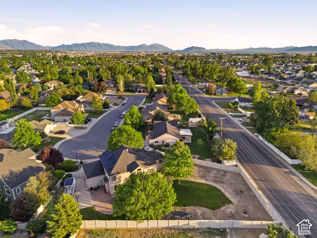Aerial representation of a residential neighborhood with mountain backdrops