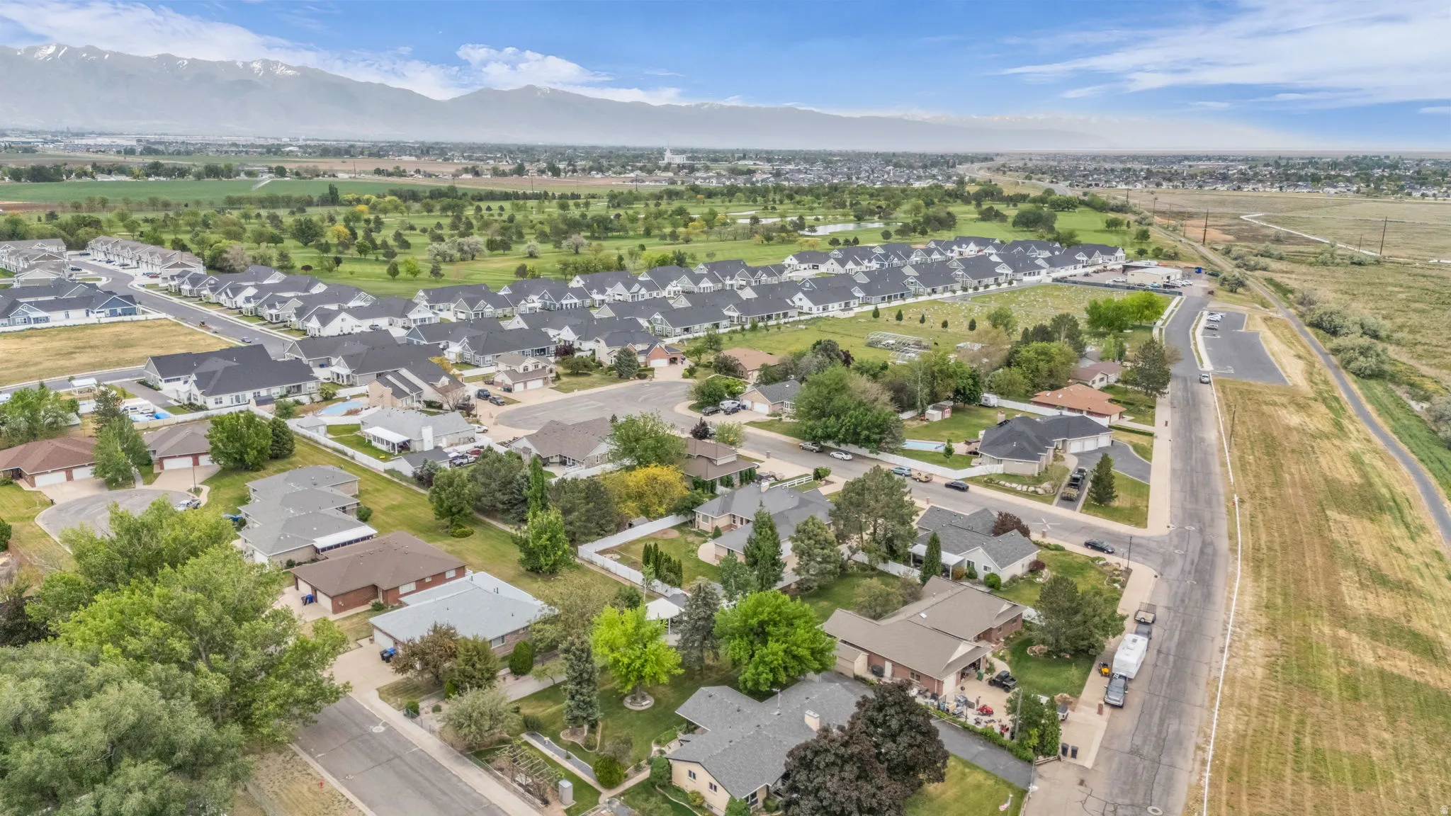 Expansive aerial perspective showcasing a residential area with varied housing styles