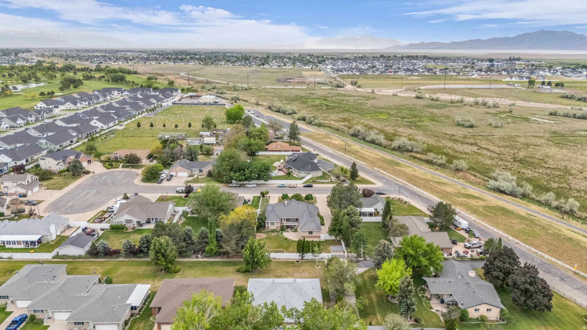 Expansive aerial perspective showcasing a residential area with varied housing styles