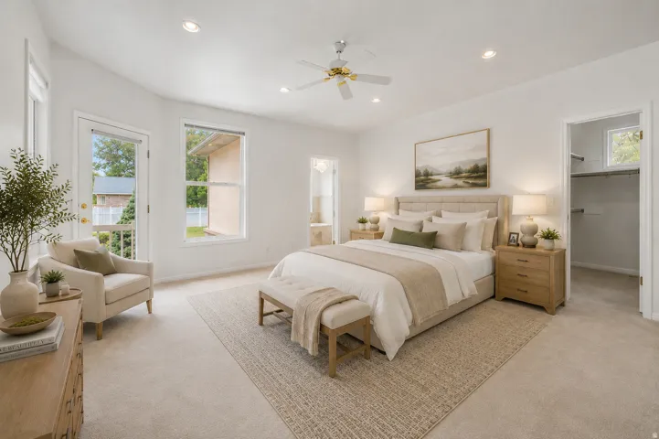 Virtually Staged-Carpeted room featuring a vaulted ceiling with recessed lighting and a ceiling fan, a glass-paned door, and a single window